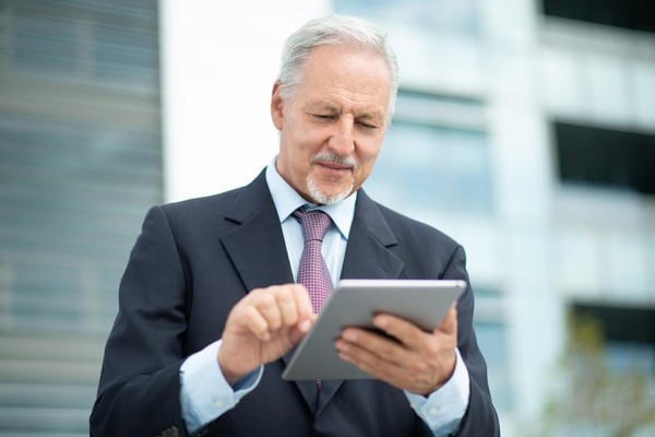 Typing on a tablet.