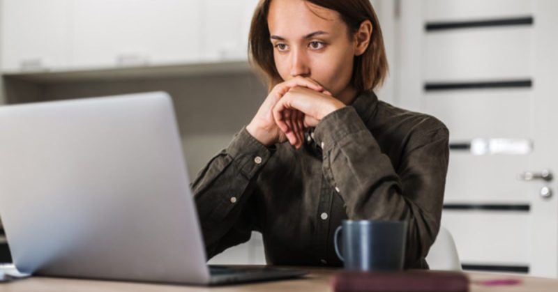 customer master data - woman staring intently at her laptop screen