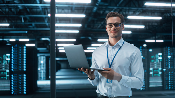 man holding a laptop - managed service provider