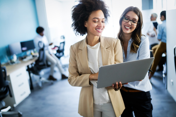 female coworkers discussing hyperautomation