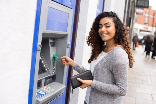 customer withdrawing money at an ATM