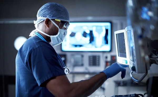 Medical doctor using medical equipment