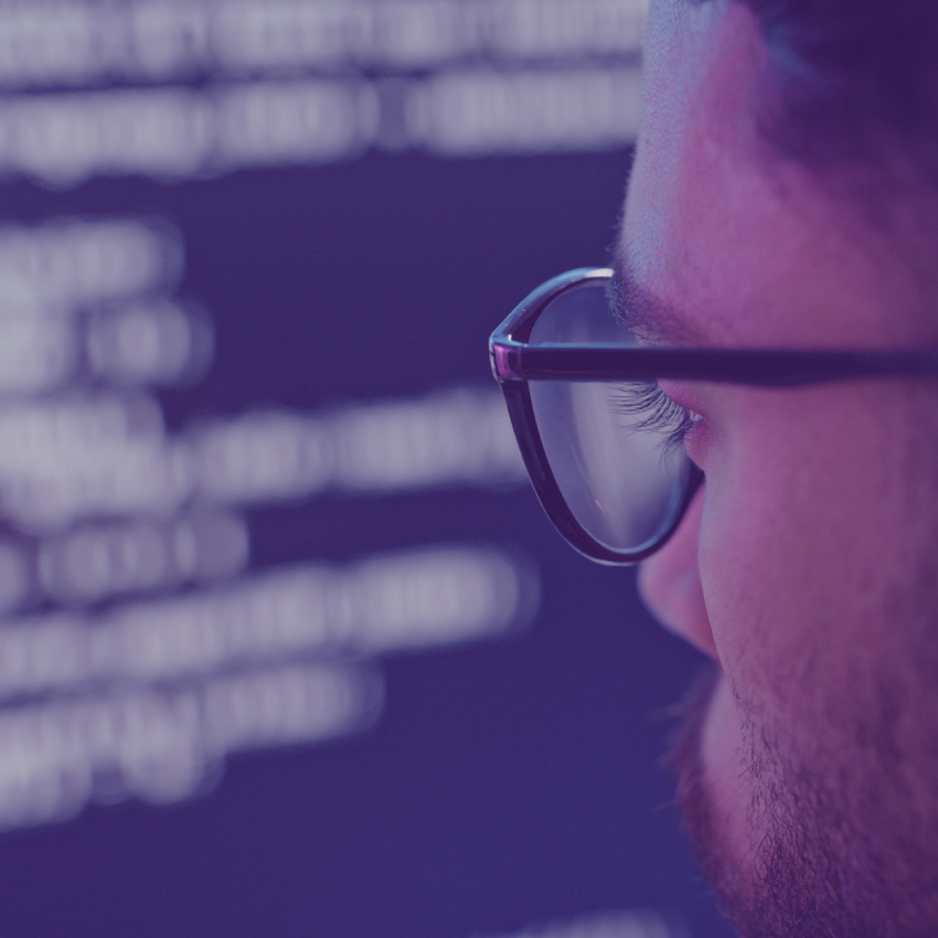 IT worker looking at computer screen