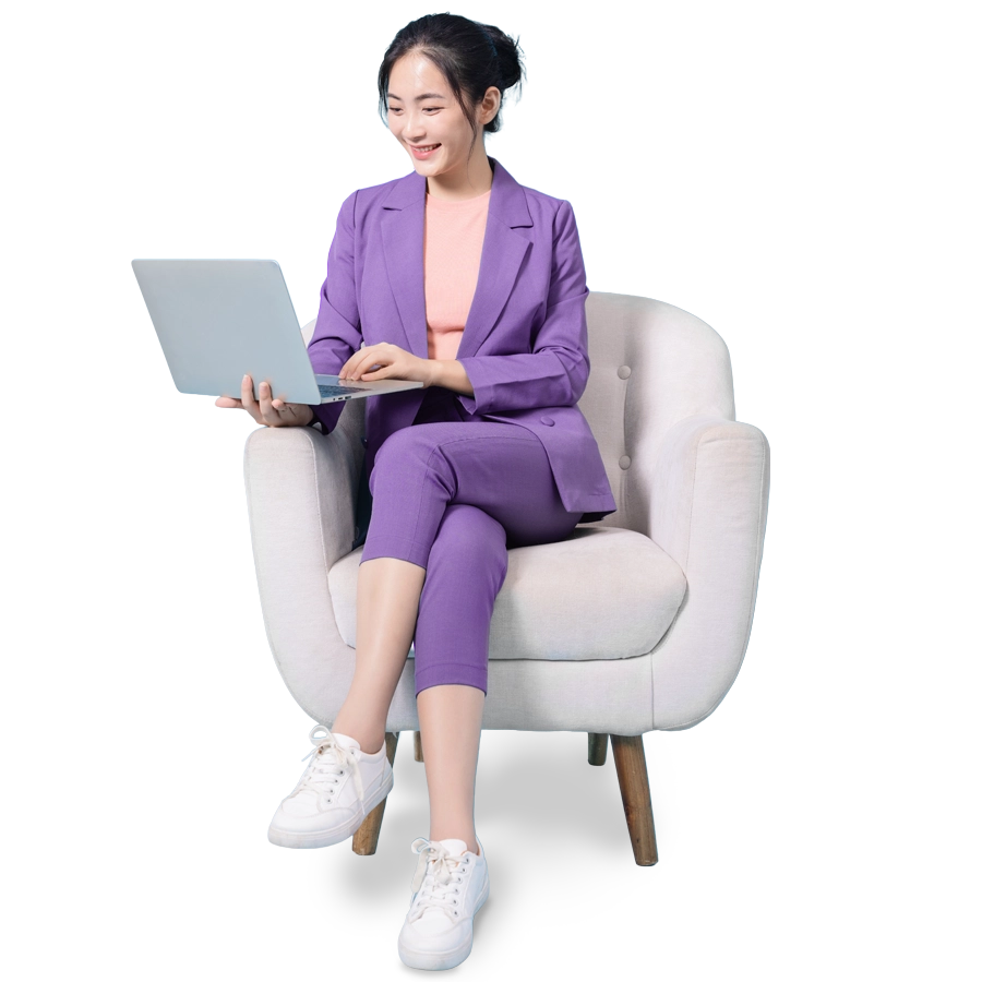 Woman on chair looking at laptop