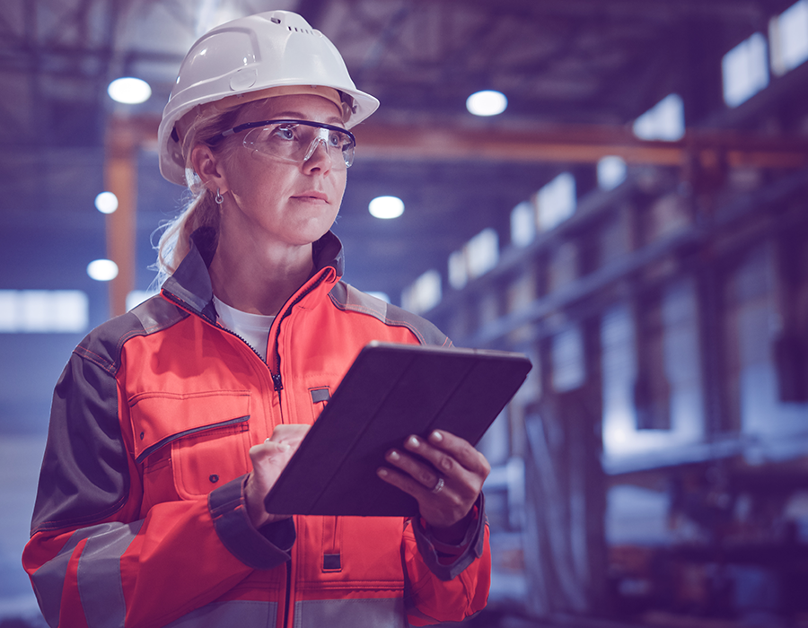 Woman using a tablet on a manufacturing floor