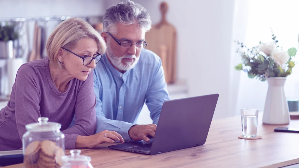 Older couple looking at laptop
